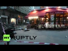 France: Forensic experts inspect suicide bomber in an attacked cafe in Paris