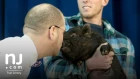 Woodbury principal kisses pig