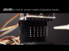 JOLED: A mid-air display based on electrostatic rotation of levitated Janus objects