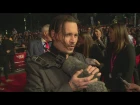 Johnny Depp fondles fluffy mic at London Film Festival's Black Mass premiere