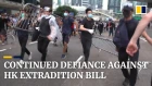 Thousands block roads in downtown Hong Kong in defiant protest against extradition bill